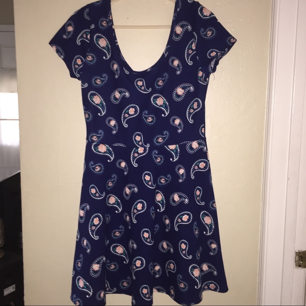 A navy blue paisley pattered dress. Mid-thigh
